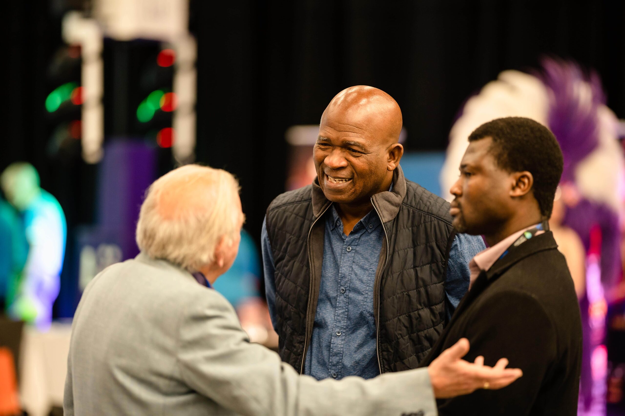 Smiling Blackpool Business Expo visitors talkiing