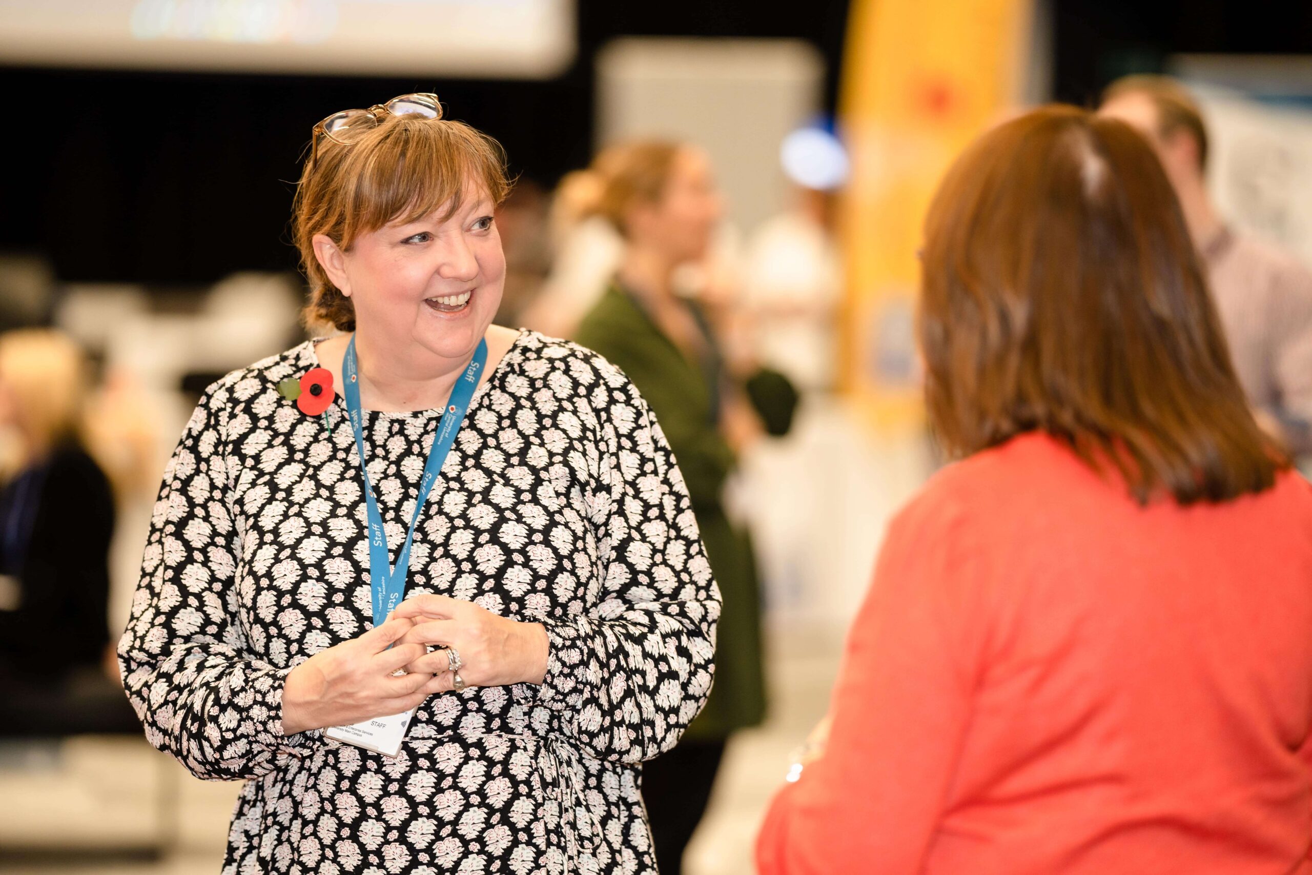A Blackpool Business Expo visitor speaking to an exhibitor