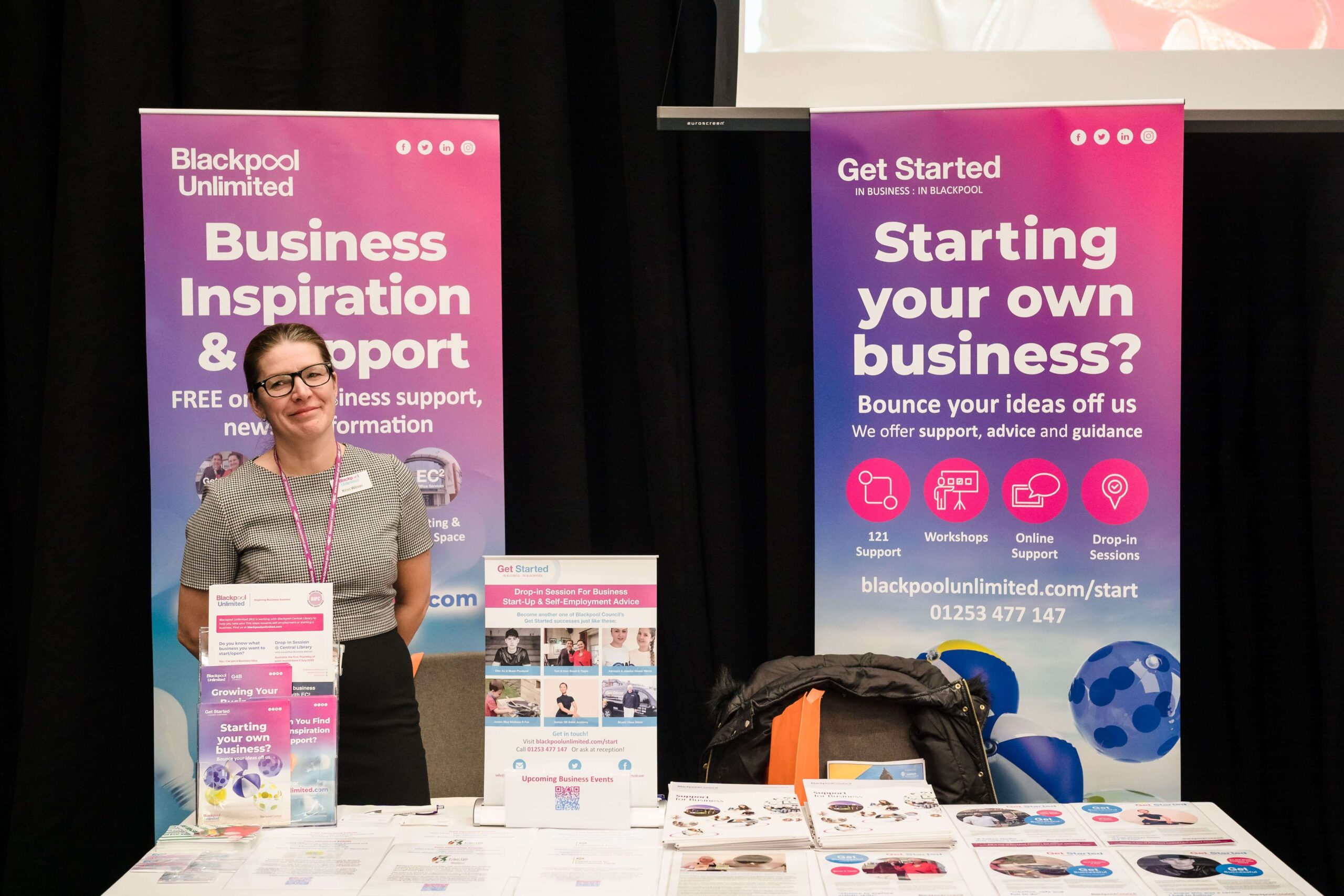 Image shows a colleague from Blackpool Unlimited exhibiting at Blackpool Business Expo.